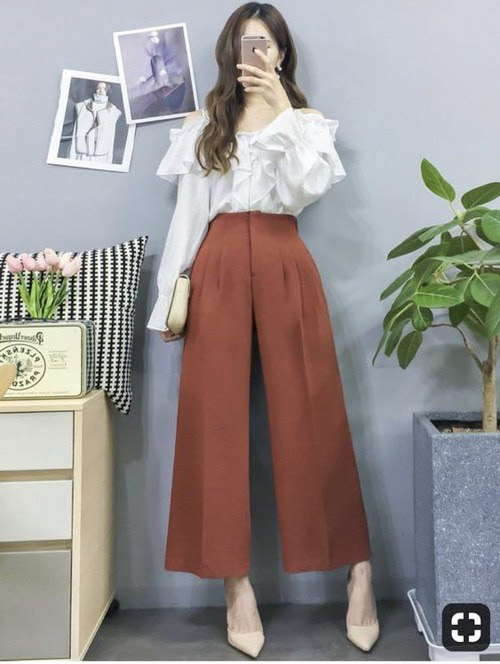 Phần tay phồng của áo sơ mi sẽ giúp cân đối cơ thể hình quả lê khi diện cùng quần culottes